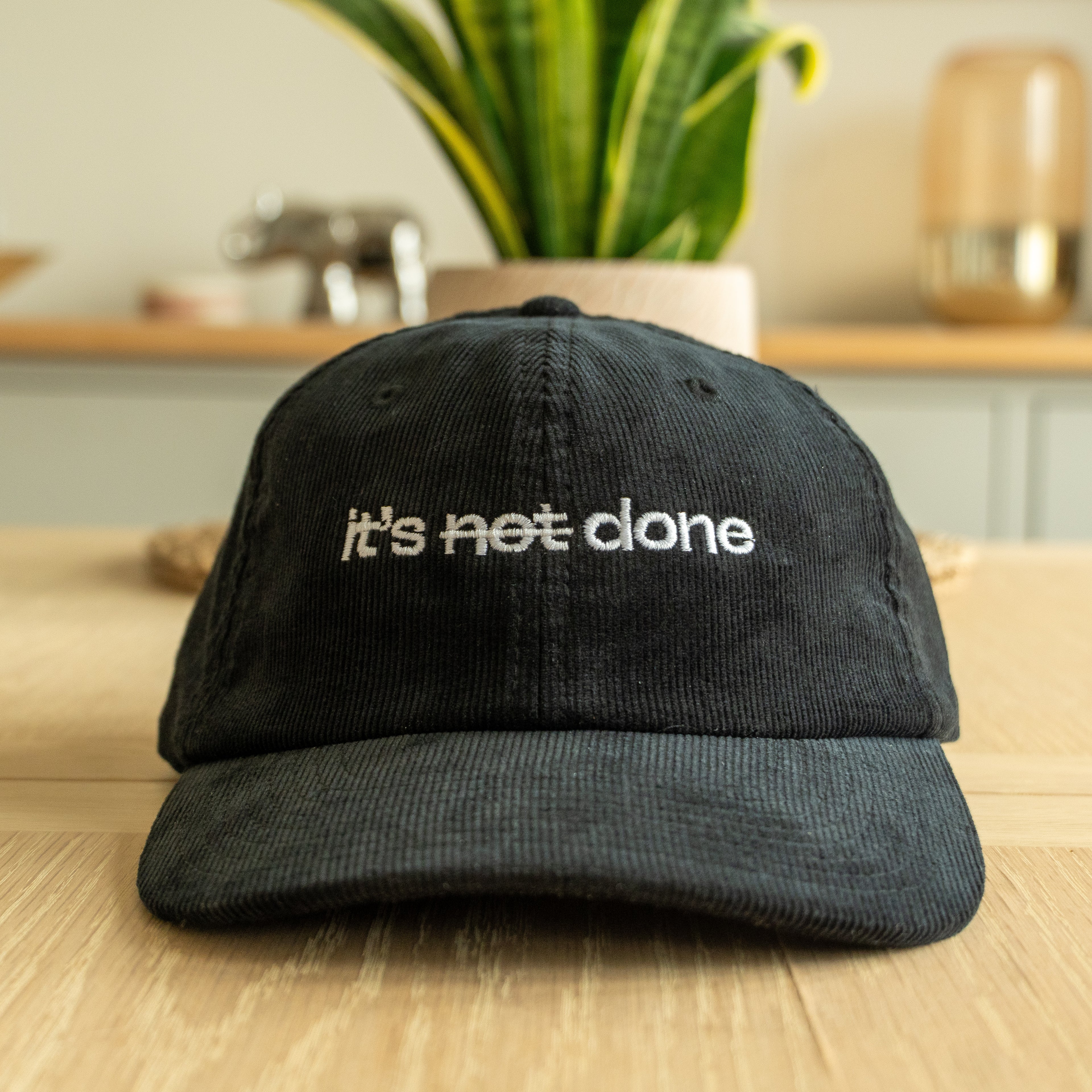 it's not done - black corduroy cap