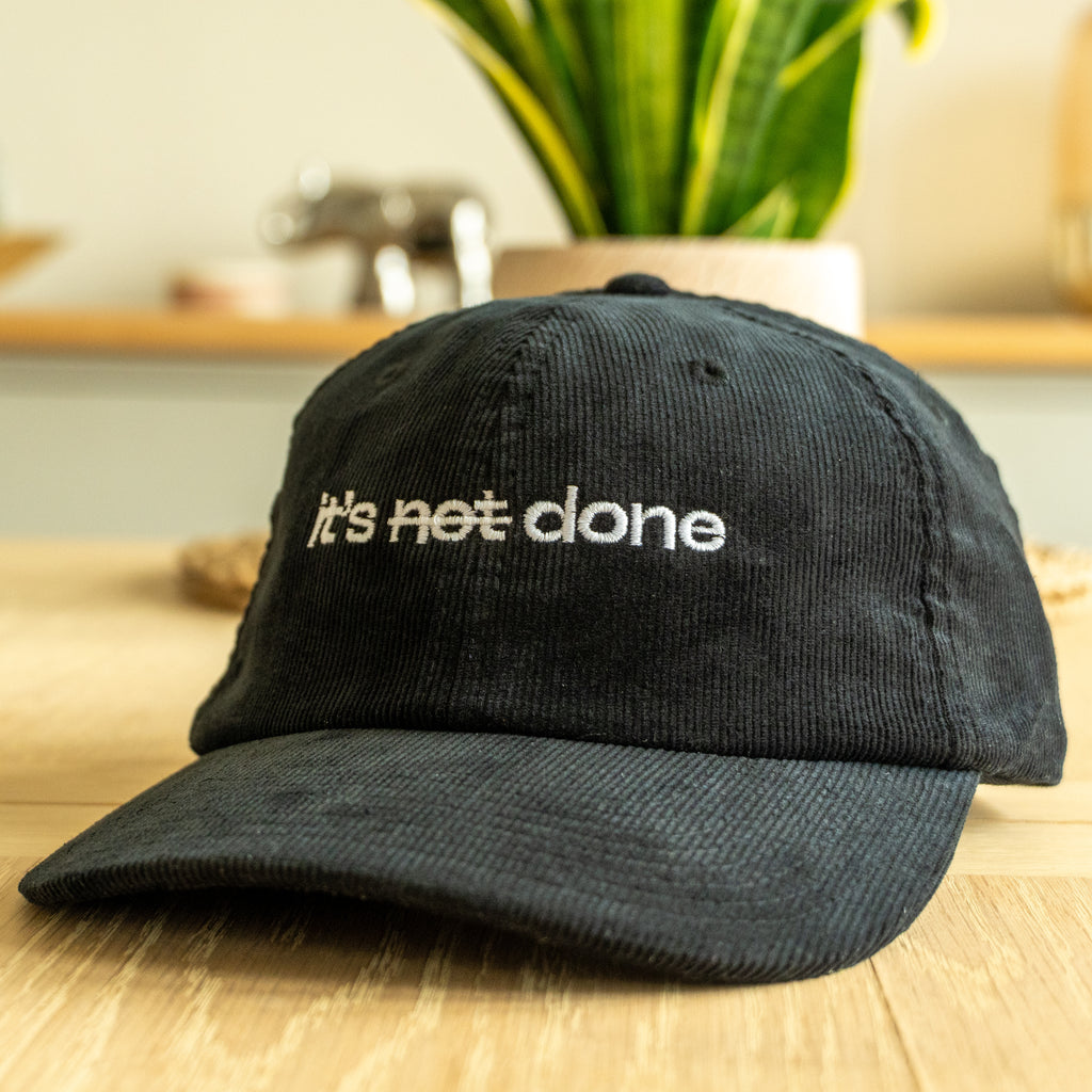 it's not done - black corduroy cap