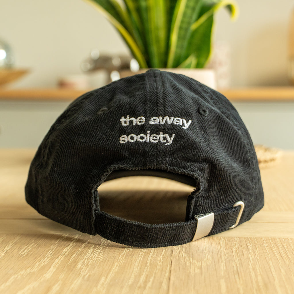 it's not done - black corduroy cap
