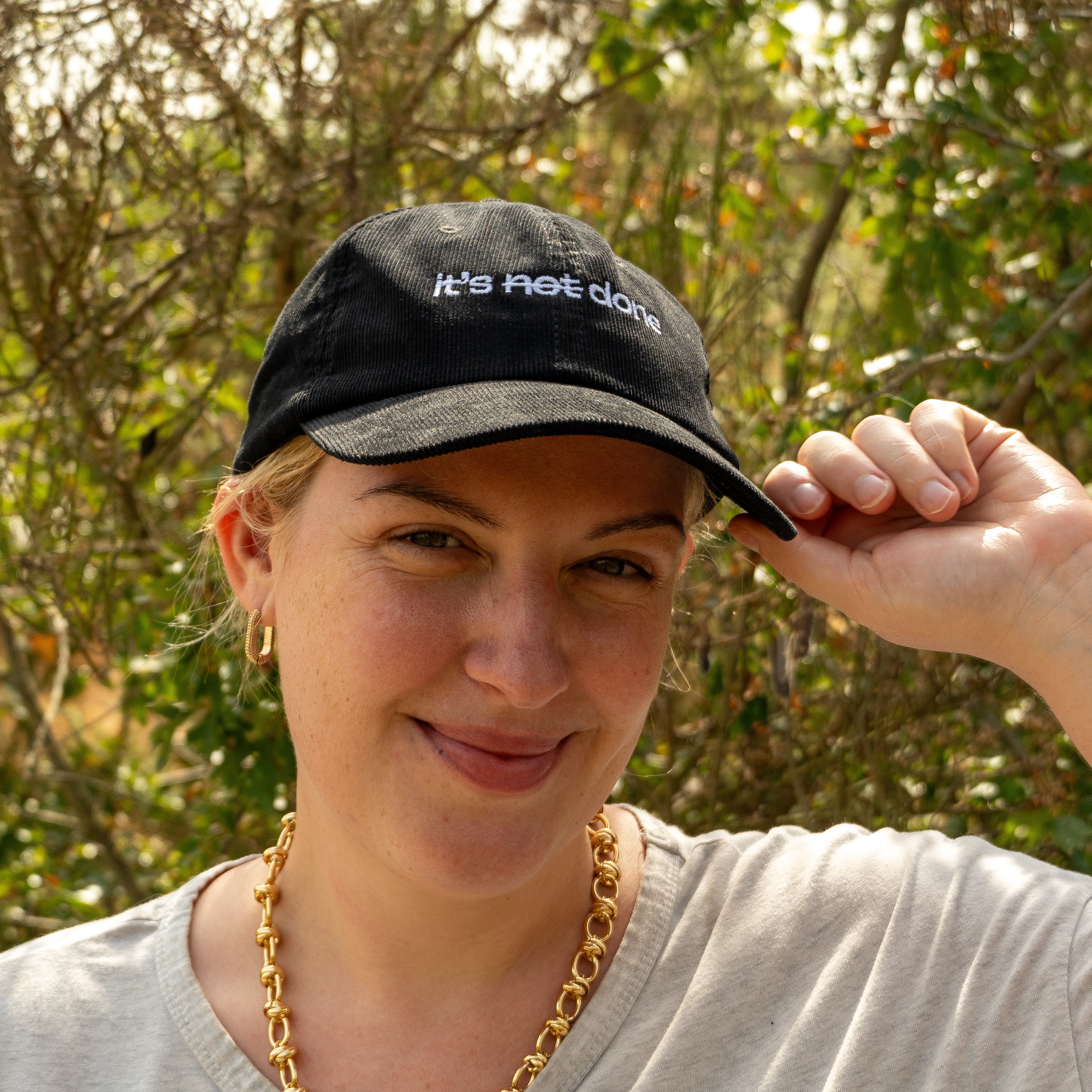 it's not done - black corduroy cap